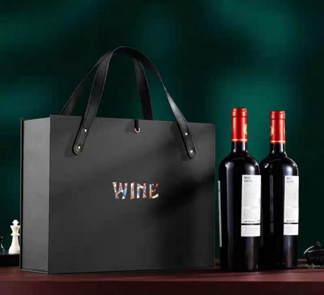 Black paper wine bag with leather handles