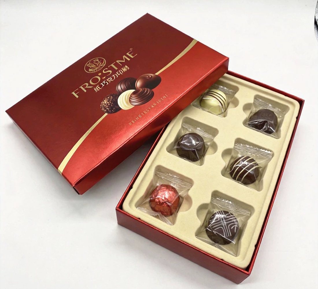 Burgundy and gold praline box with fitted tray